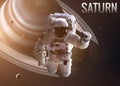 Astronaut exploring space in Saturn orbit